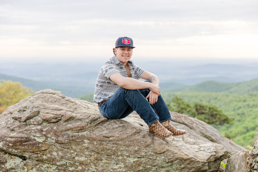 High school senior posing at sunrise with mountain views in Shenandoah National Park