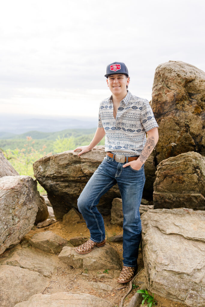 High school senior posing at sunrise with mountain views in Shenandoah National Park