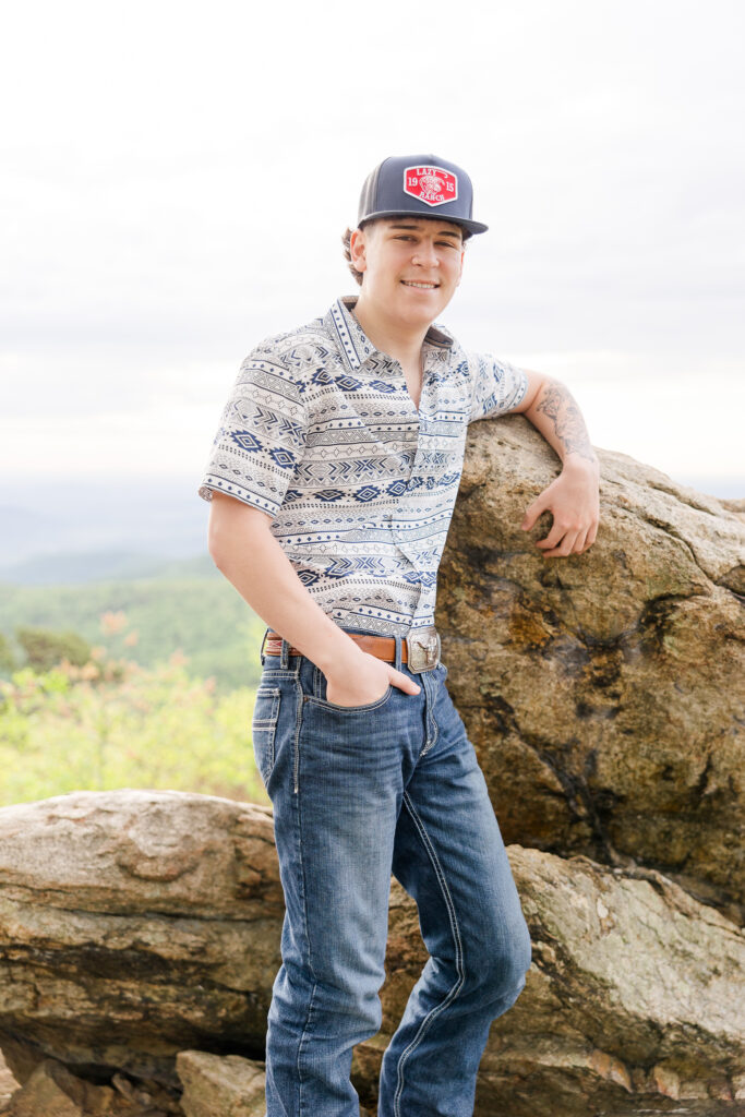 Graduating senior smiling during golden hour photo shoot in Shenandoah National Park