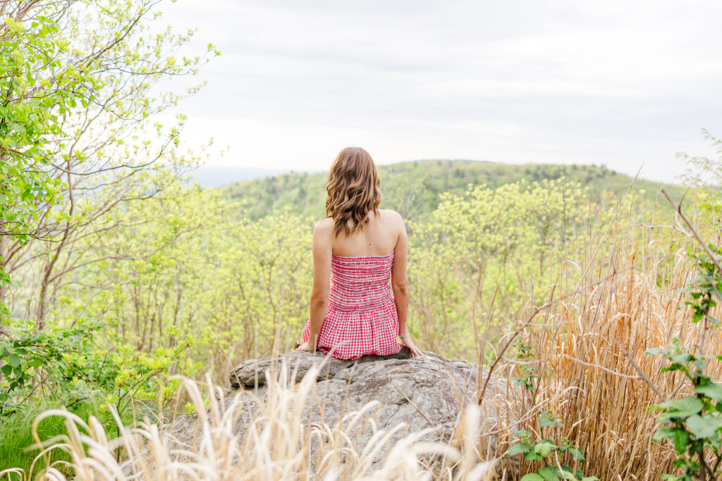 back of a senior on Skyline Drive overlook in Shenandoah National Park