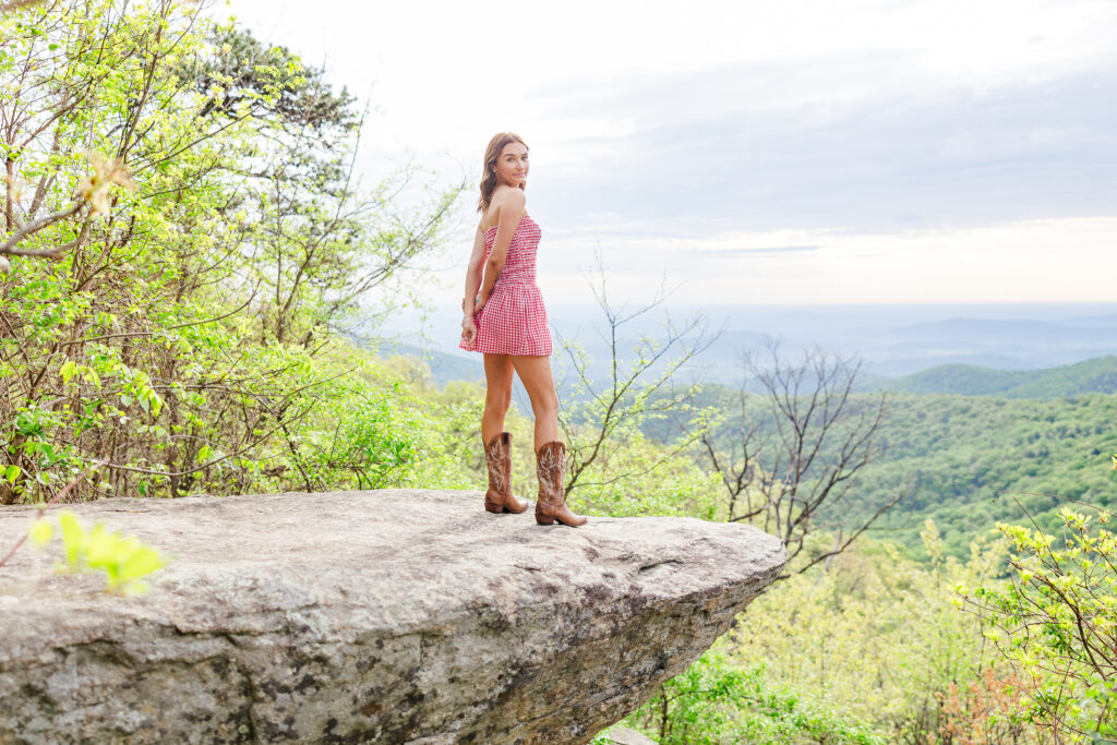 senior girl on a big rock overlooking the blue ridge mountains on Skyline Drive in Shenandoah National Park
