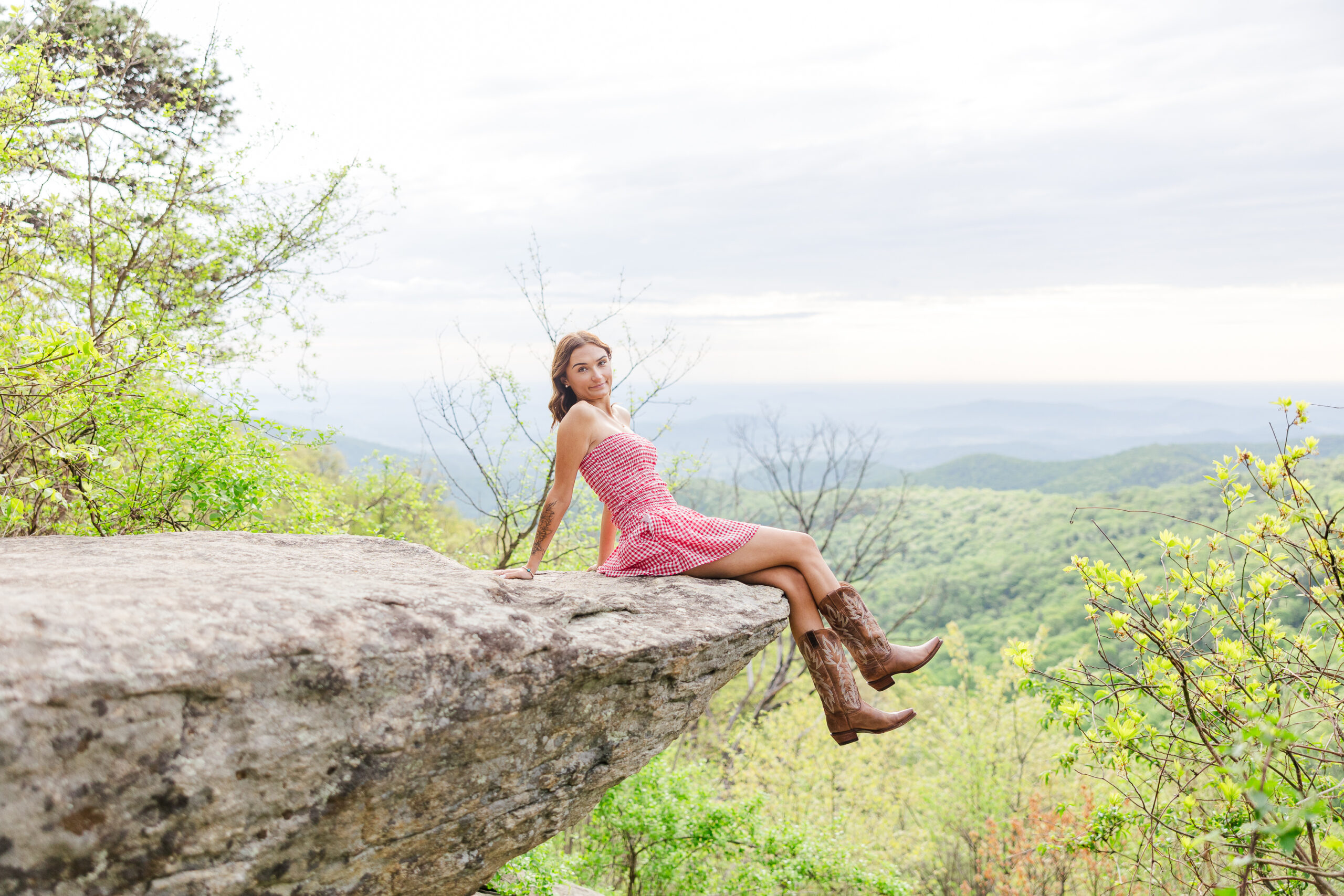 scenic Mountain View with senior posing at an overlook in Shenandoah National Park