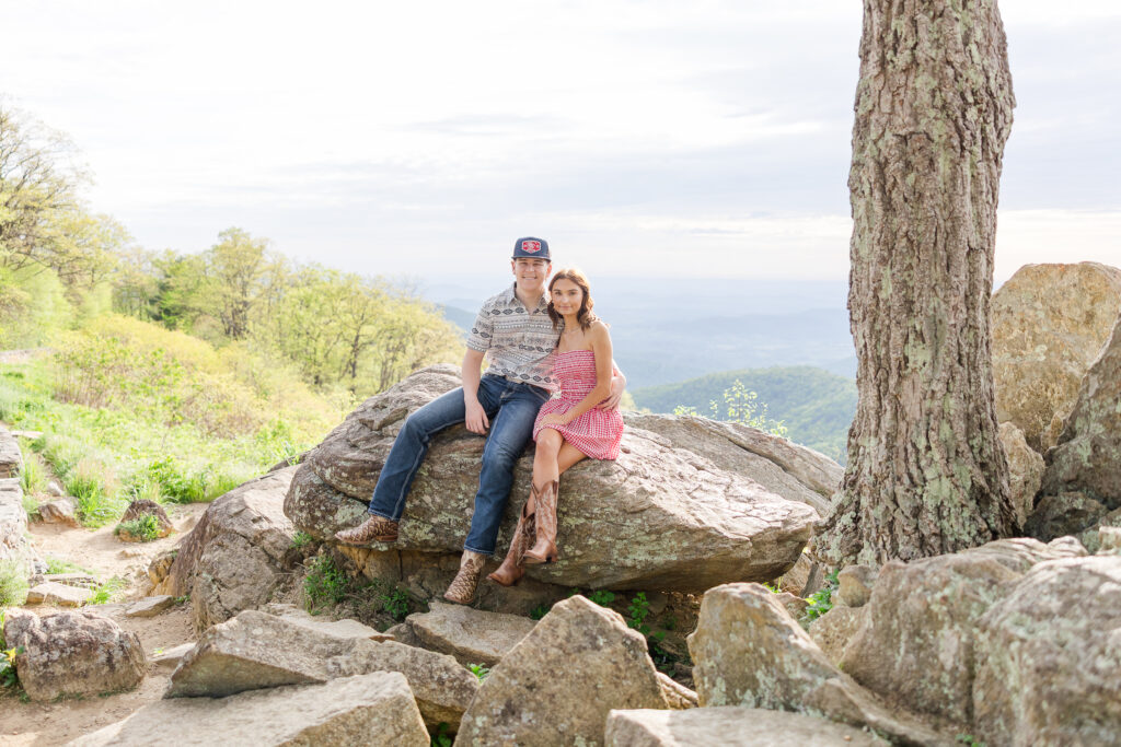 Couple on a rock during golden hour photo session in Shenandoah National Park
