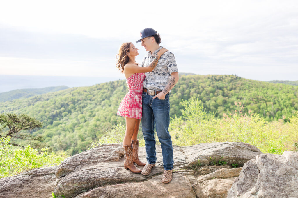 candid moment between two seniors during a sunrise session with Shenandoah National Park photographer
