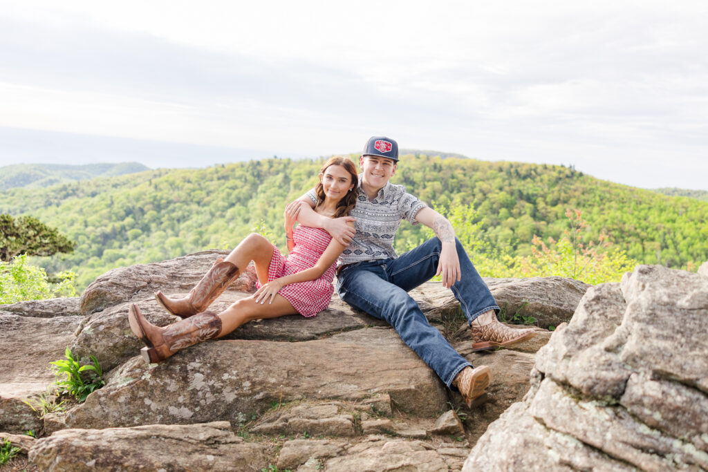Boyfriend and girlfriend senior couple smiling during a photo session in Shenandoah National Park